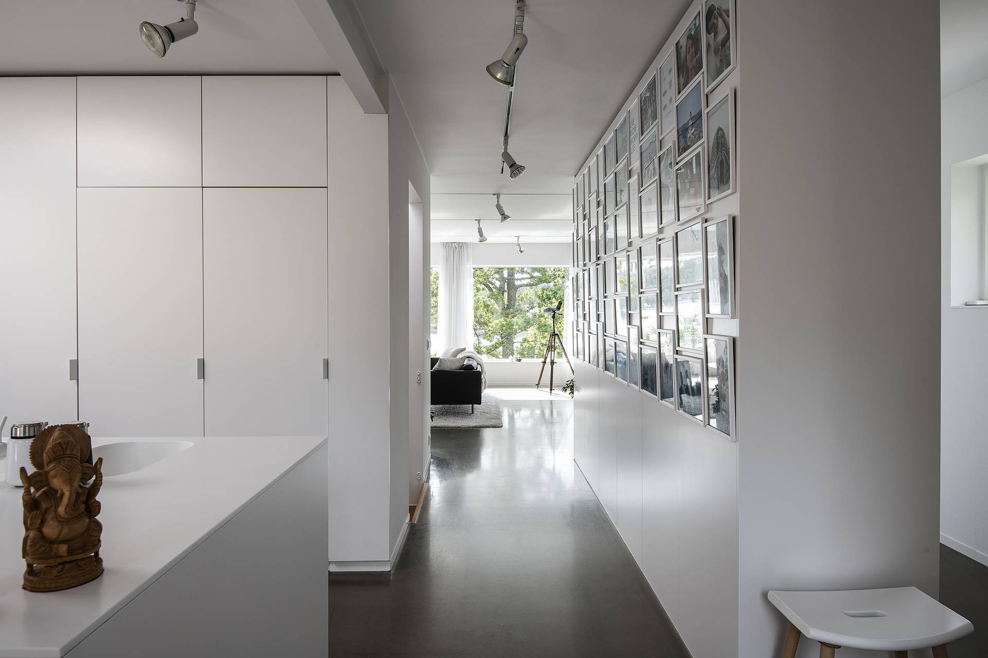 Home with a hallway and pictures on the wall